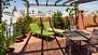 Sevilla Apartamento - The upper terrace has sun-loungers and roof-top views.