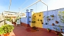 Seville Apartment - Roof-top terrace with outdoor shower, canopy, table and chairs.