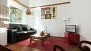 Seville Apartment - Living room with sofa, central table and TV. Free wi-fi internet.