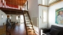 Seville Apartment - View towards the dining area. Stairs lead to the bedroom and terrace.